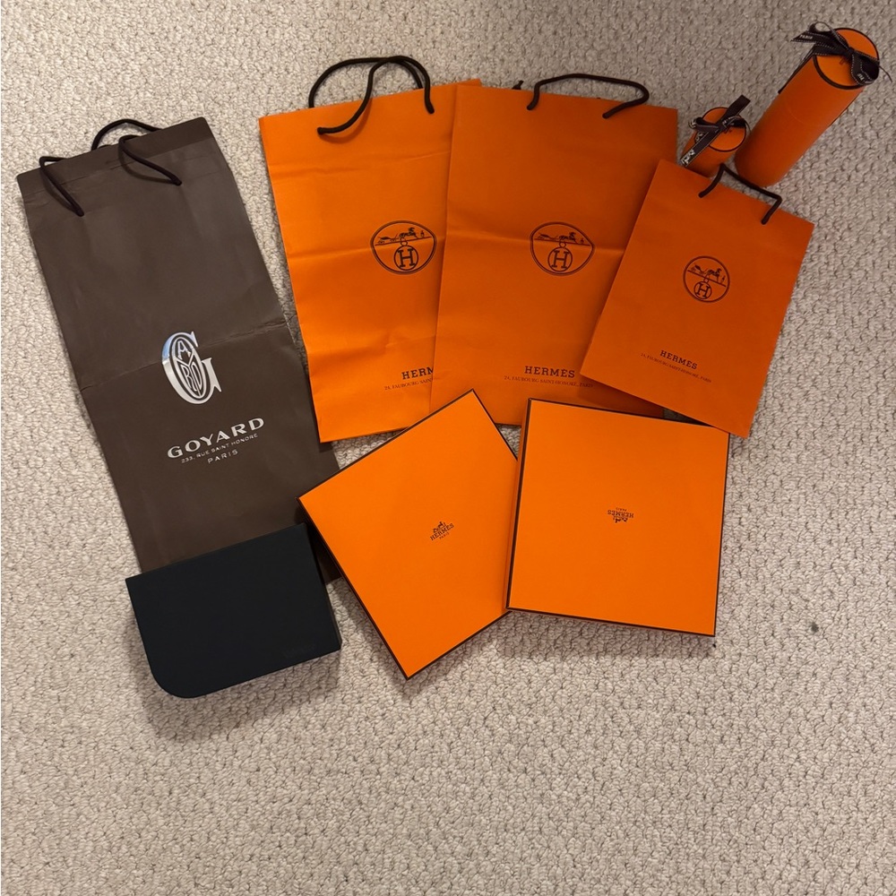 Hermes and Goyard and Valextra lot of shopping bags and boxes